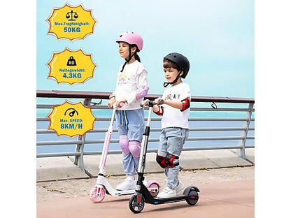 Zwei Kinder, die auf dem ME2 Electric Kid Scooter fahren, eines auf einem weißen Scooter mit rosa Griffen und Rädern, das andere auf einem schwarzen Scooter mit roten Griffen und Rädern. Der Text zeigt die maximalen Tragfähigkeiten und die Geschwindigkeit.